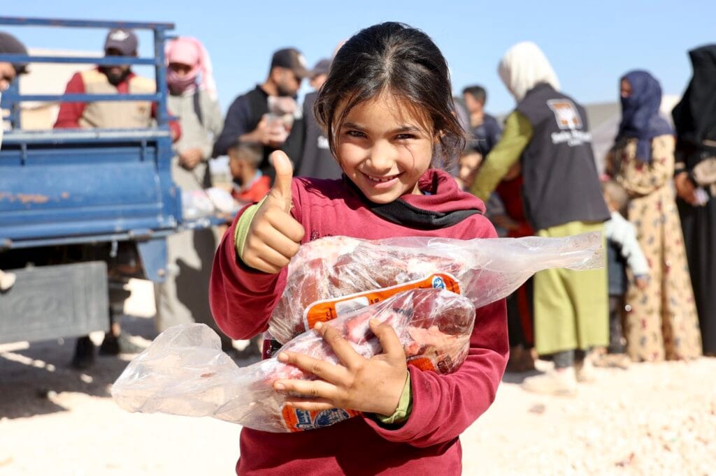 Child holding Kurban donation